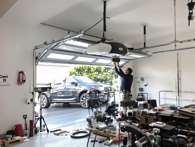 Ansonia Garage Door Repair specialist installing smart garage door opener system in Ansonia home