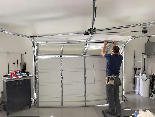 Ansonia Garage Door Repair specialist performing precise section replacement on Ansonia garage door